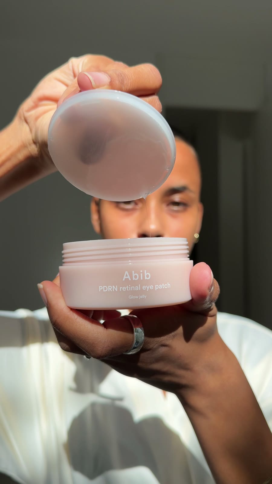 Melanie presenting a skincare jar