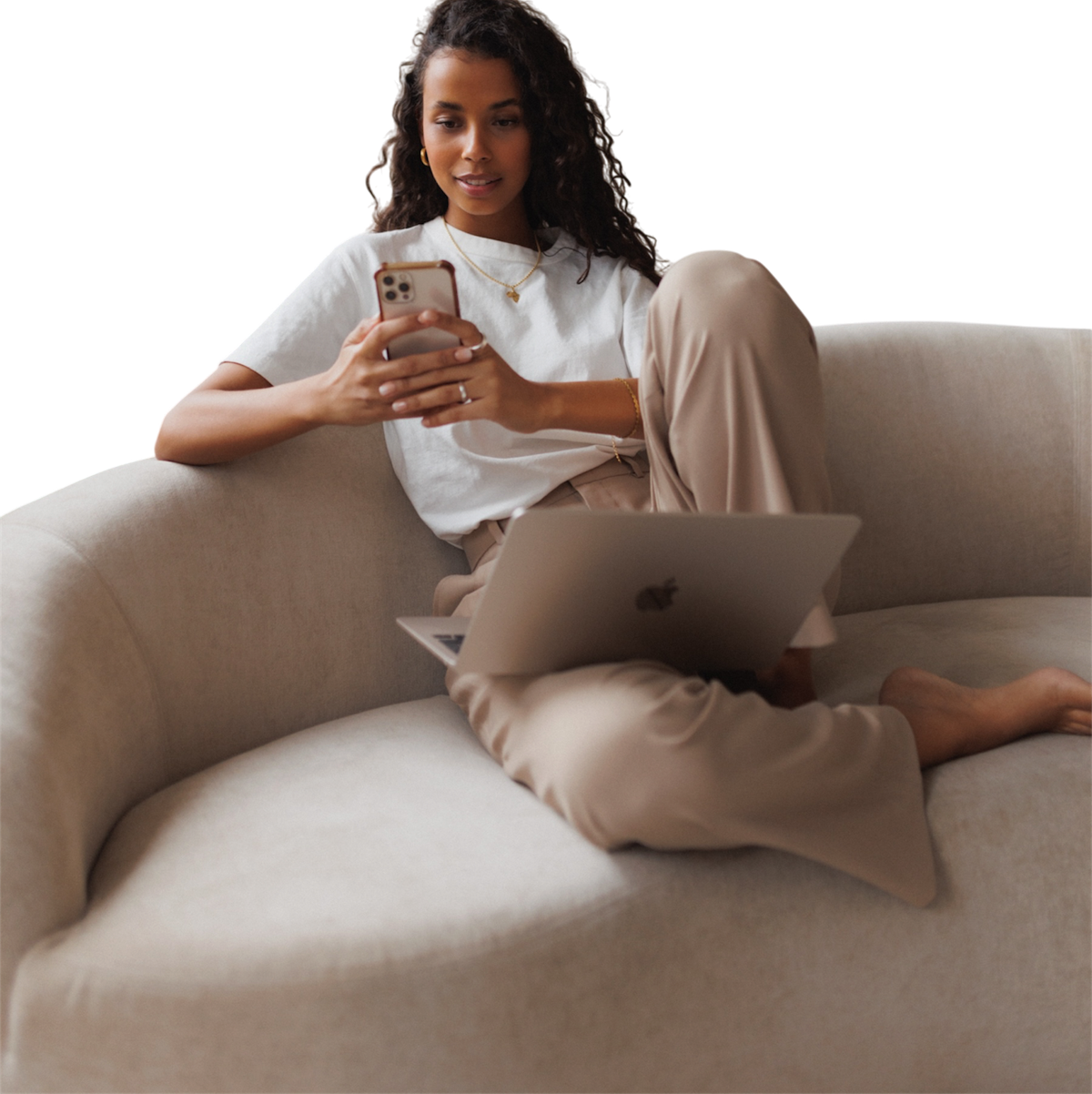Melanie relaxing on a sofa with her phone